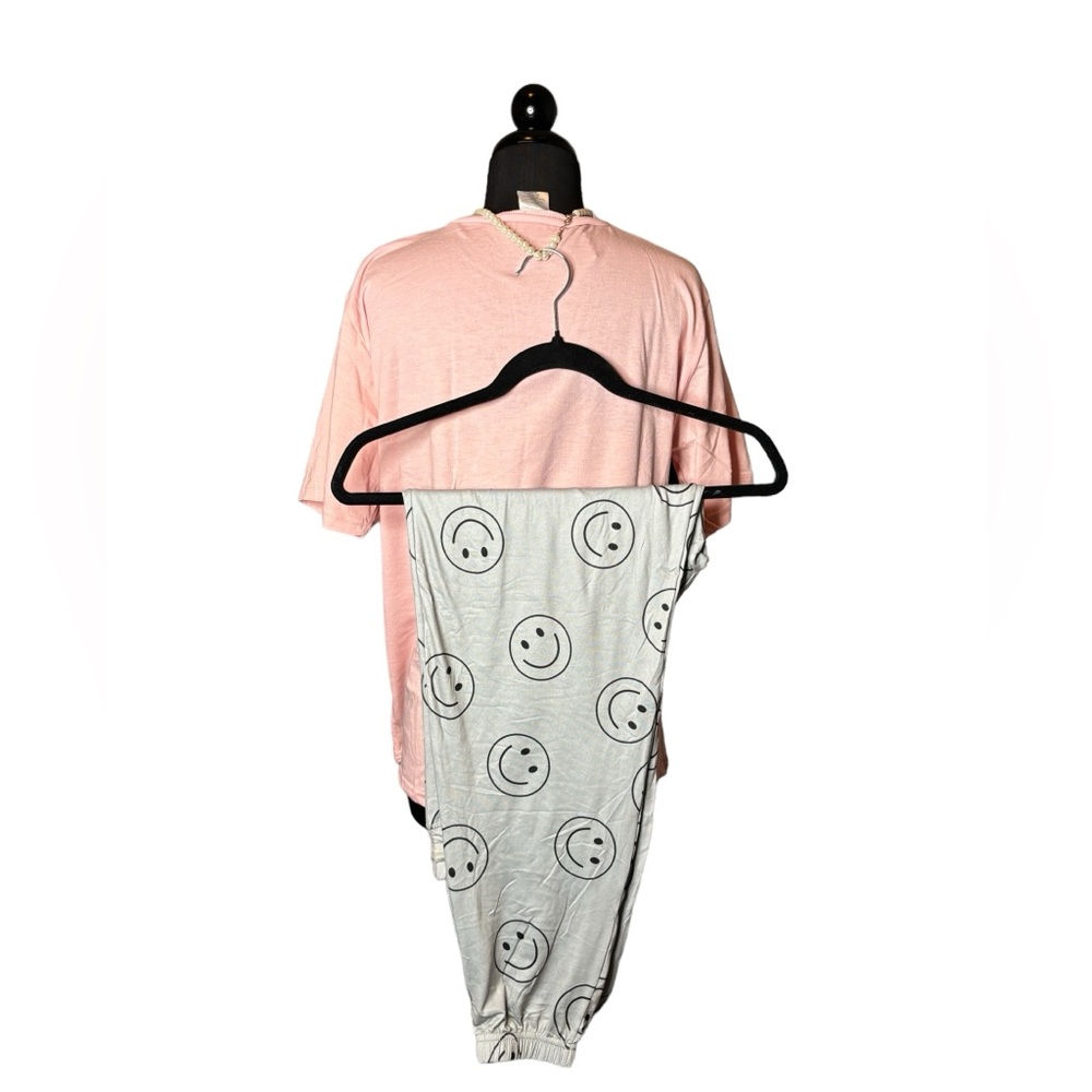 Sold Pink pajamas with peace and happy signs. New. 21” ptp 26” shoulder to hem - Picture 2 of 3